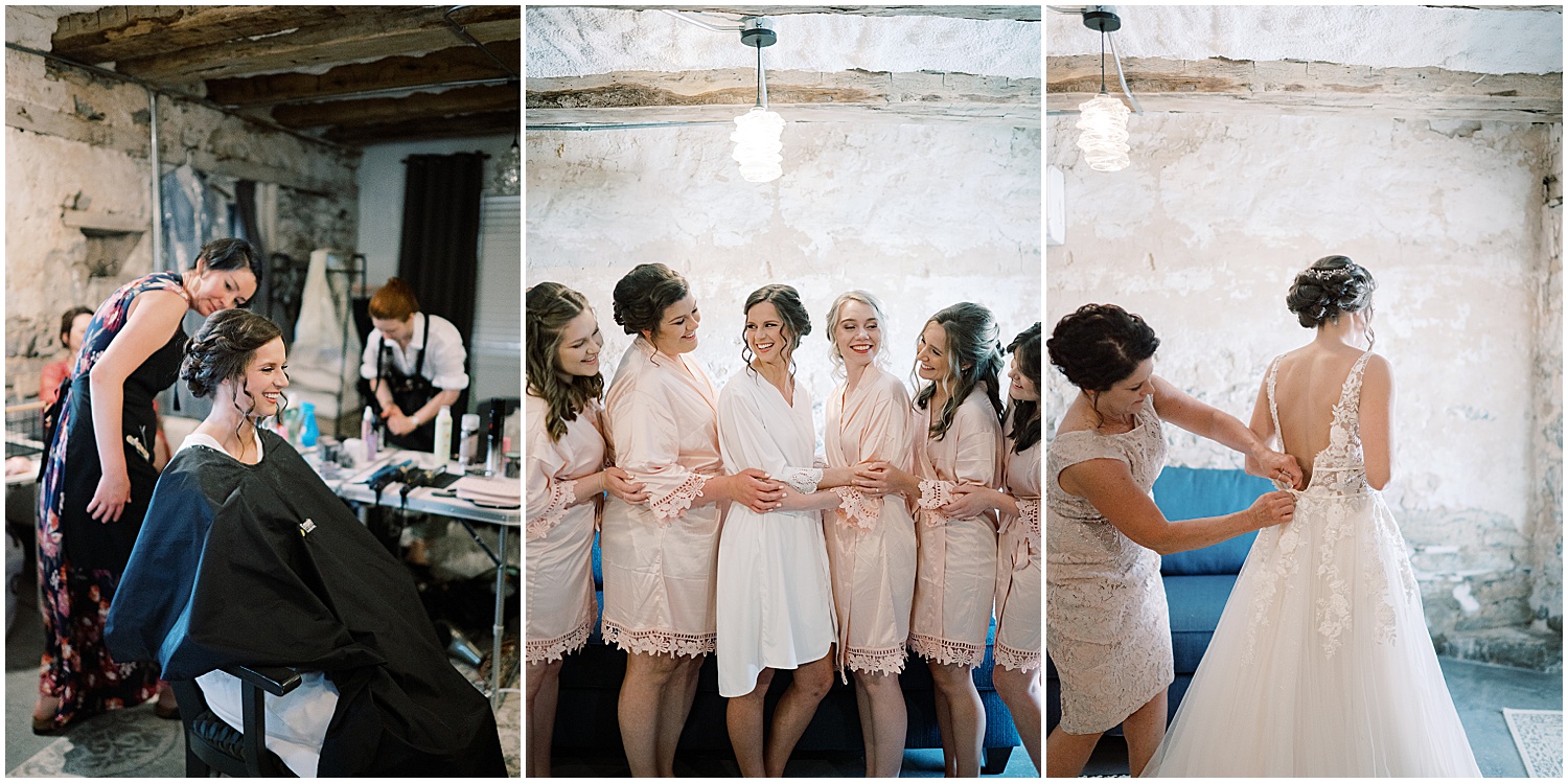 bride and bridesmaids wearing blush pink robes white getting ready at Dupont Farm Wedding barn 