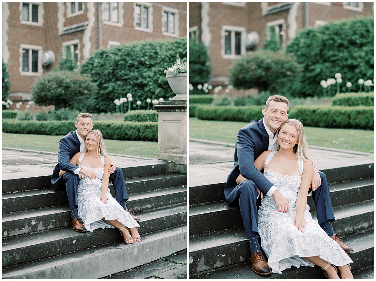 engaged couple sitting on steps at waveny house on cloudy evening 