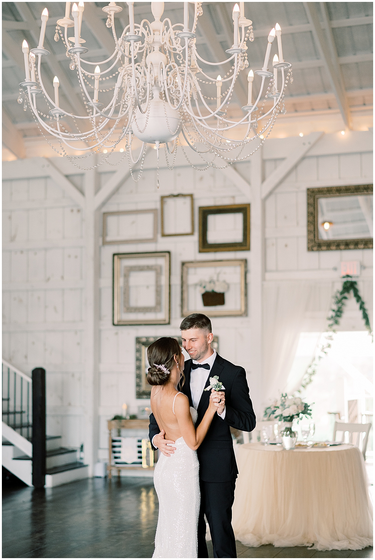 first dance from newly married couple inside reception barn by Maryland wedding photographer 